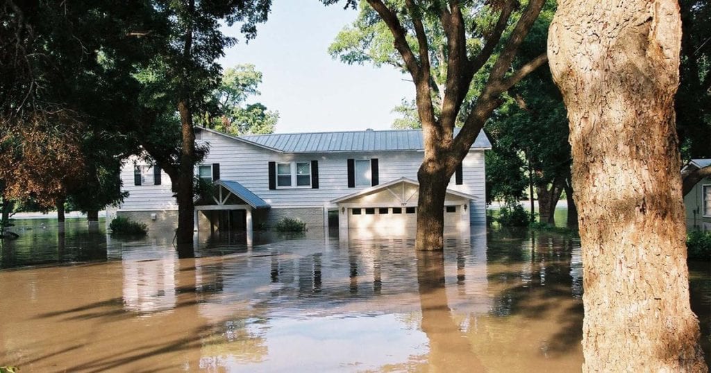 A picture of a house damaged by water flood