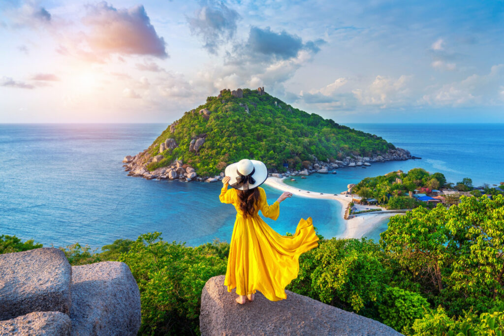 A picture of a woman wearing a yellow dress and a hat